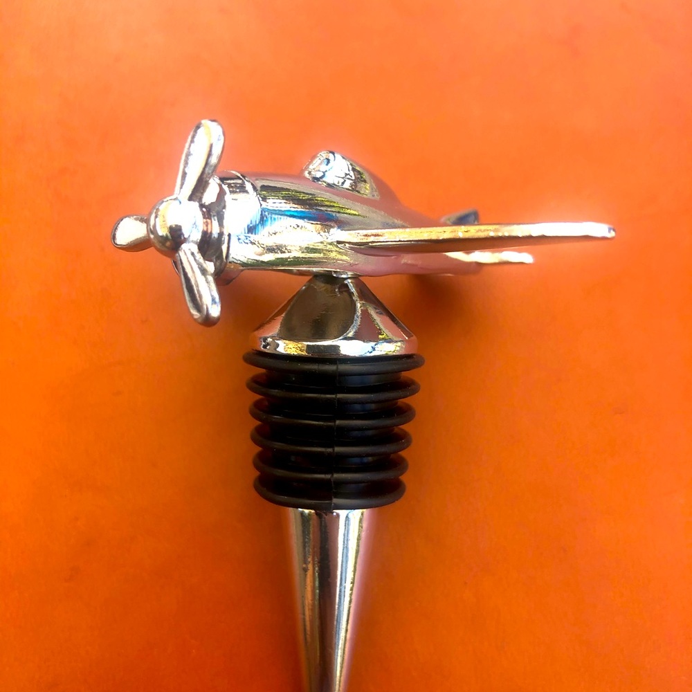 5 chrome Airplane wine stoppers.